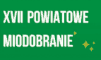 Zielona plansza z napisem "XVII Powiatowe Miodobranie"